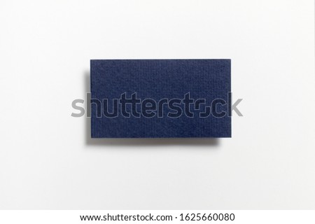 Blue blank matt wool textured business card flying and isolated on white background, us standard size 3.5 x 2 inches, real professional studio photo.