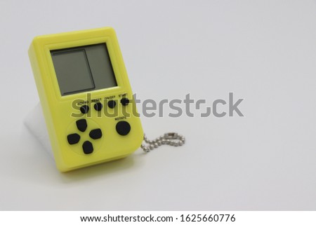 Close up of miniature handheld retro game console
