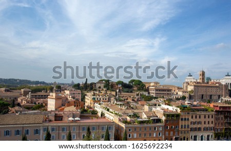 Panoramic view of the roofs in Rome and St Peter's Cathedral in the background