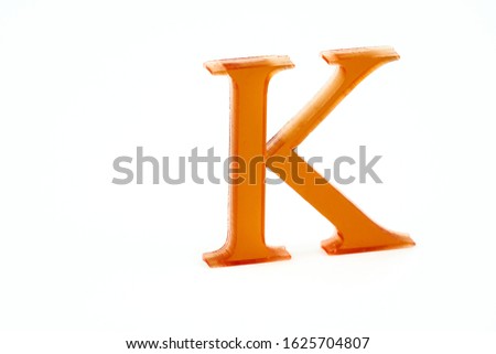 Letter K. 3d printed. Red Color. Isolated white background.
