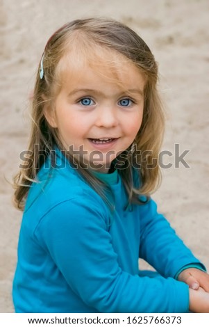 Toddler girl portrait on beach