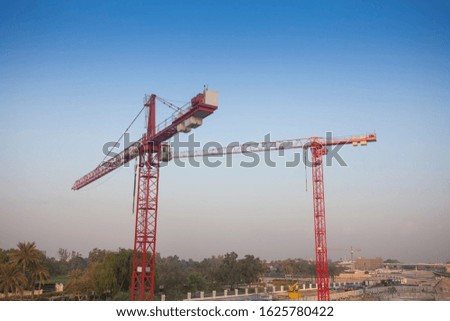 silhouette of construction cranes, industrial photo