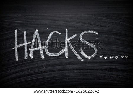 The word Hacks written on a blackboard as a reminder to look for shortcuts in problem solving