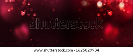 Abstract red bokeh and heart background. Romantic valentines panorama with glittering effects. Love concept with space for design and text.