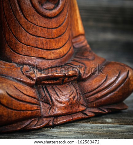 Meditation conceptual image with focus on Buddhas hands