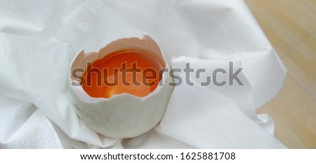 a picture of a broken or split duck egg