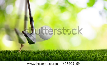 Slow motion of golf club hitting golf ball on tee.
 Royalty-Free Stock Photo #1625905159