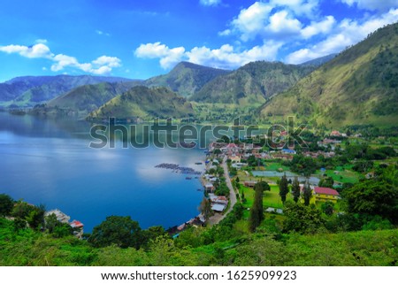 grainy and noisy photo of volcano Lake Toba (Danau Toba) or Toba Lake in the morning . one of the biggest lake in the world , located in North Sumatera, Indonesia Royalty-Free Stock Photo #1625909923
