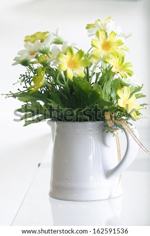 Artificial flowers in the vase.