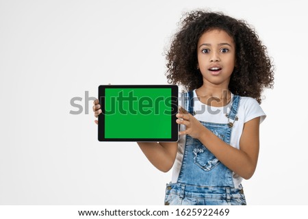 Shocked teenager girl with tablet isolated on white background