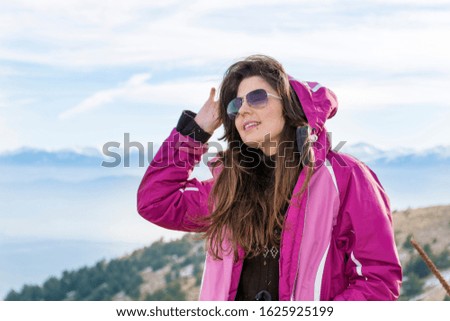 Woman in the High Snowy Mountain .Winter Vacation Concept 