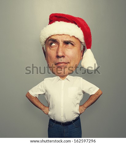 funny portrait of thoughtful santa man over dark background 