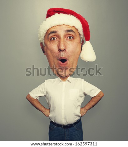 funny picture of excited bighead man in red santa hat
