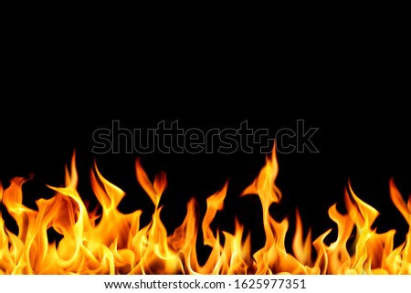 Blazing flames over black background