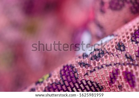 Pink floral pattern fabric cloth macro blur background