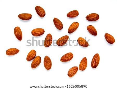 Raw Natural Organic Almonds Nuts Scattered Isolated on White Background  Healthy Food for Life Natural Light Selective Focus
