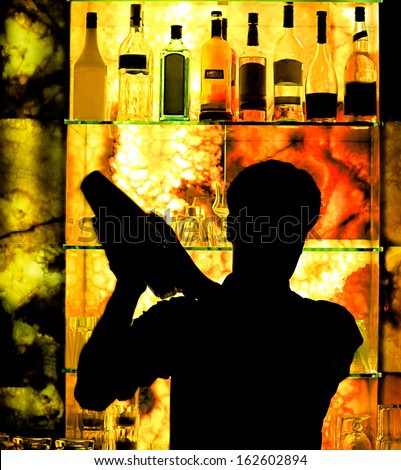 Silhouette of classic bartender shaking drink at fashion cocktail bar - Food and beverage concept with professional barman working on mixology restaurant service Royalty-Free Stock Photo #162602894