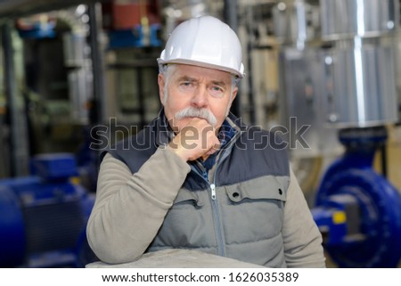 portrait of a senior plantation engineer posing