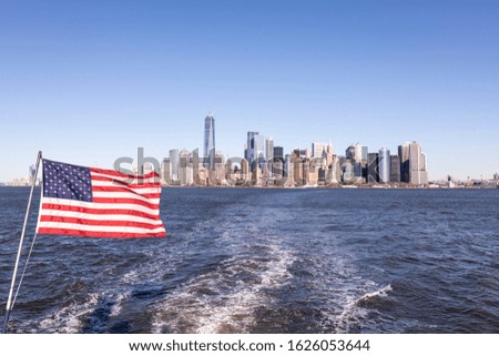 Lower Manhattan Cityscape with American Flag
