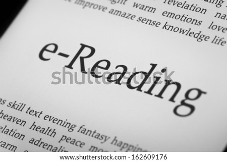 eReader with backlit screen closeup. Shallow depth of field