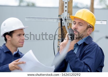 the construction workers outside building