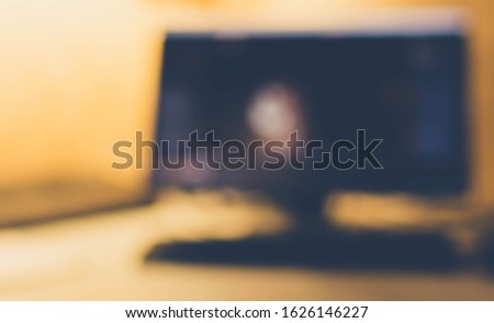 Beautiful blur of a personal computer in warm colors