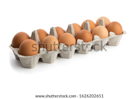 one dozen brown eggs in a cardboard egg carton isolated on white Royalty-Free Stock Photo #1626202651