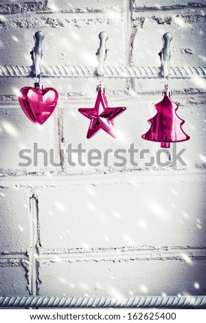 Christmas decorations on white brick wall background 