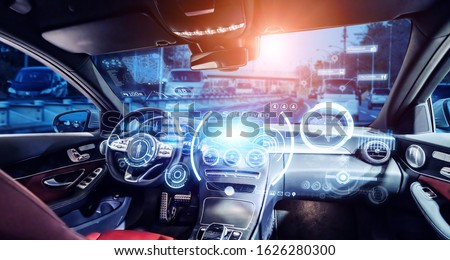Interior of autonomous car. Driverless vehicle. Self driving. UGV. Advanced driver assistant system. Royalty-Free Stock Photo #1626280300