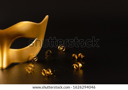 Close-up Golden mask with copy space. Carnival, Mardigras, or Brazilian carnival concept.