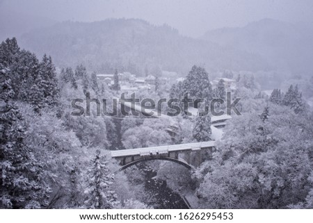 
Countryside snow scene and railway bridge
