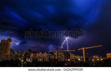 Storm and lighting over house. Thunderstorm at night near village.