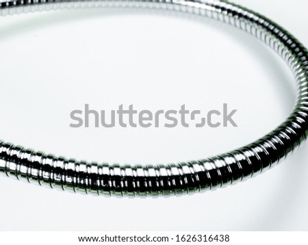 Wire covered with stainless metal isolated on white background macro shoot