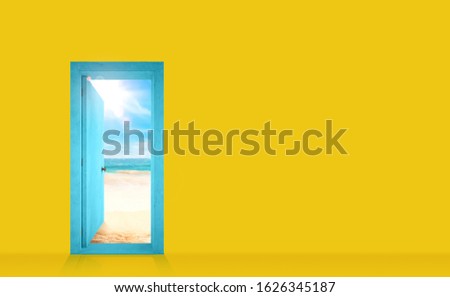 Door into a yellow wall that opens onto the beach