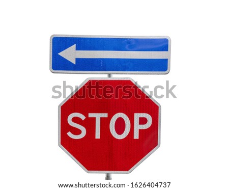 Conceptual red stop sign with blue left arrow sign on white background