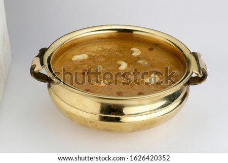 predaman payasam-sweet dish which is famous in south india made  in special occasions  arranged in an urule in indian style garnished with dry fruits