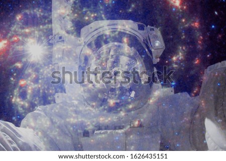 Astronaut in outer space. Science fiction art. Elements of this image furnished by NASA