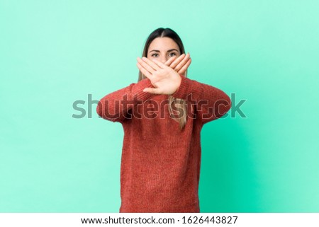 Young caucasian woman isolated doing a denial gesture