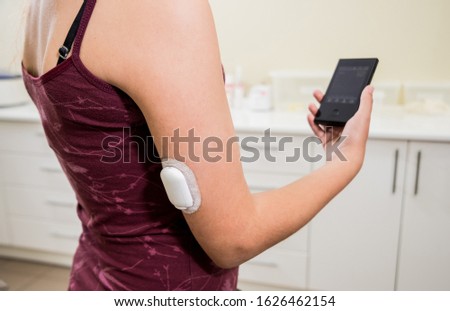 Medical device for glucose check. Continuous glucose monitoring pod.  Royalty-Free Stock Photo #1626462154