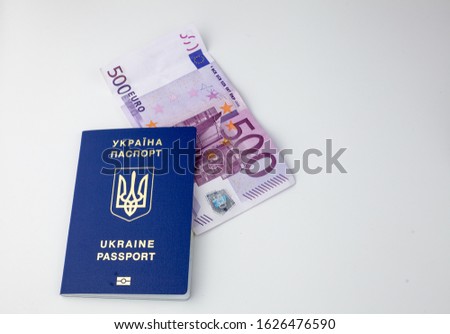 Ukrainian passport and money. Biometric foreign passports, euros, hryvnias, dollars. Travel background.