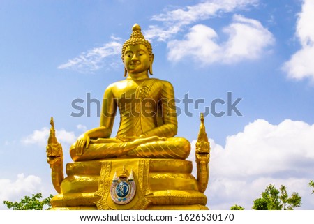 Golden Buddha statue in Phuket, Thailand
