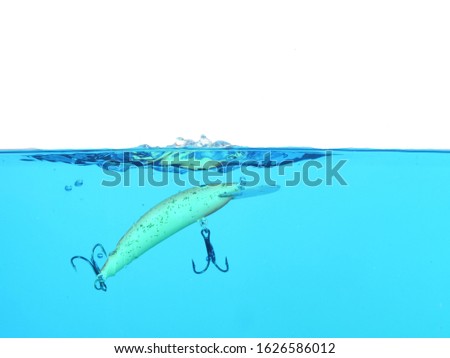wobbler for fishing in water on white background