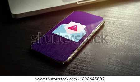 Spam Email Message Distribution, Malware Spreading Virus - smartphone with spam mail notification with alert and warning message icon. Irrelevant unsolicited e-mail malicious software, scam, fraud Royalty-Free Stock Photo #1626645802