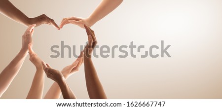 Symbol and shape of heart created from hands.The concept of unity, cooperation, partnership, teamwork and charity. Royalty-Free Stock Photo #1626667747