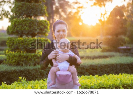 Mother and daughter in the park in the evening.