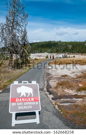 Picture of warning sign in nature path, Yellowstone NP.