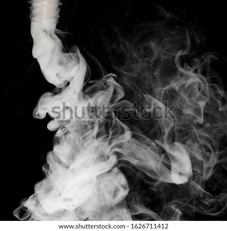 white isolated smoke blowing from bottle or source