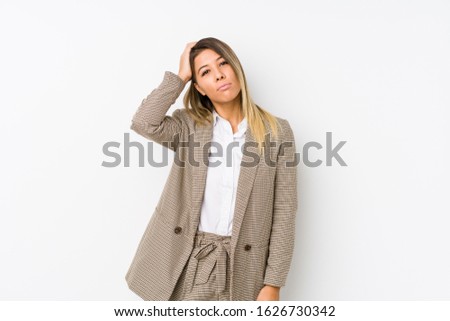 Young caucasian business woman isolated being shocked, she has remembered important meeting.