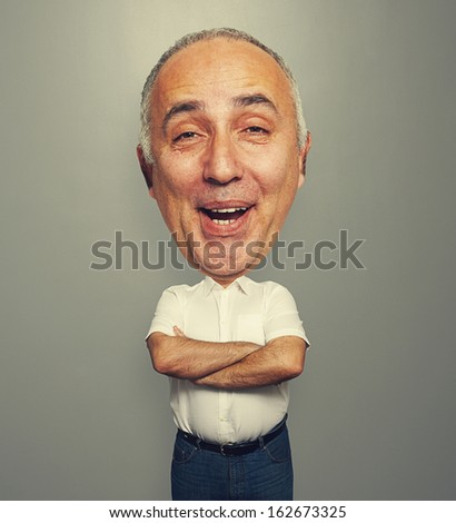 funny picture of laughing senior man over dark background