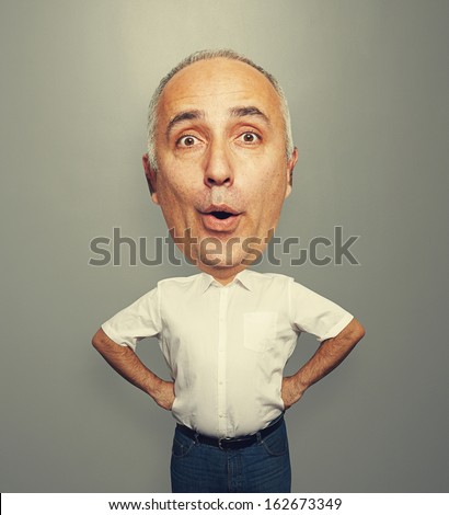 funny picture of excited senior man with big head over dark background